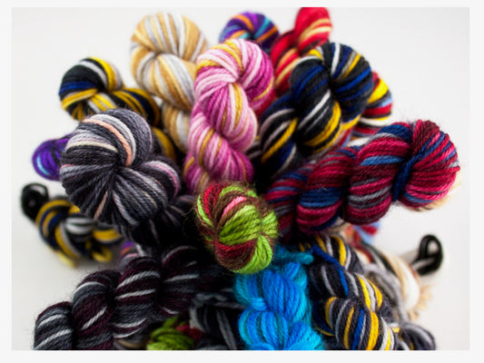 Mini skeins of self-striping yarn