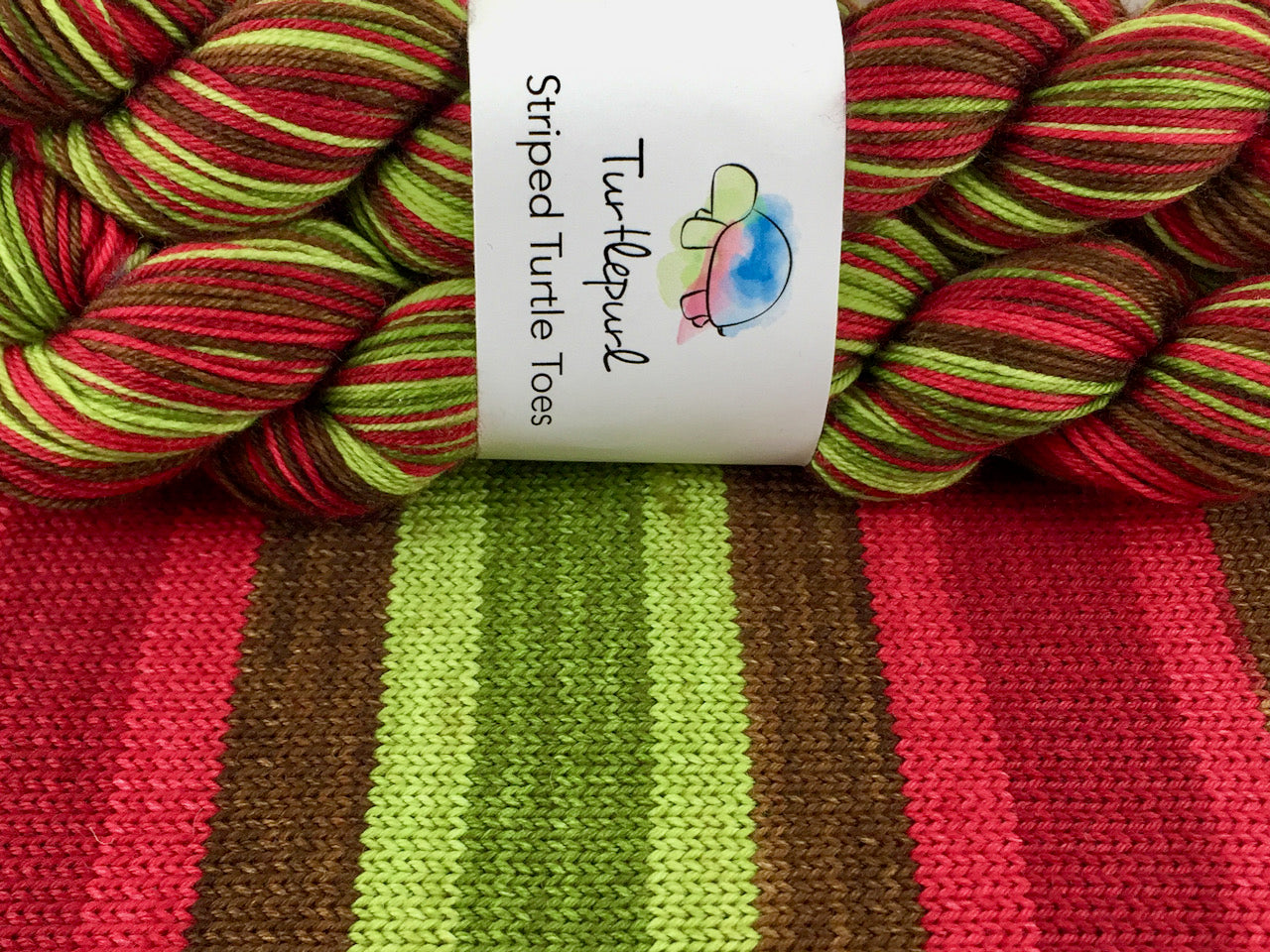 Poison apple self-striping sock yarn